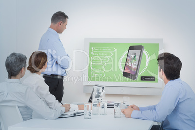 Composite image of business team looking screen