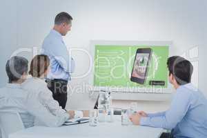 Composite image of business team looking screen