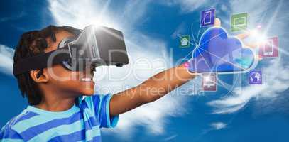 Composite image of side view of little boy holding virtual glass