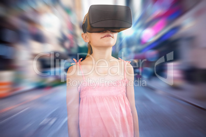 Composite image of girl using a virtual reality device