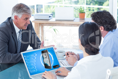 Composite image of business people in discussion in an office