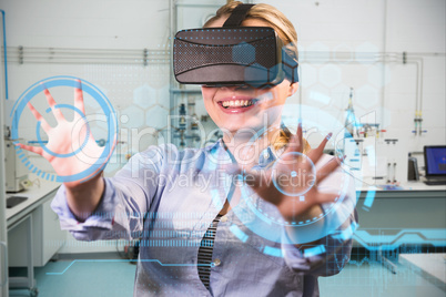 Composite image of woman using a virtual reality device