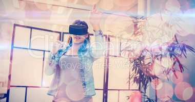 Businesswoman gesturing while using virtual reality headset