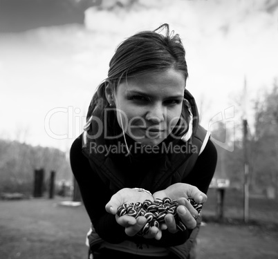 Square black and white girl holding small spheres bokeh backgrou