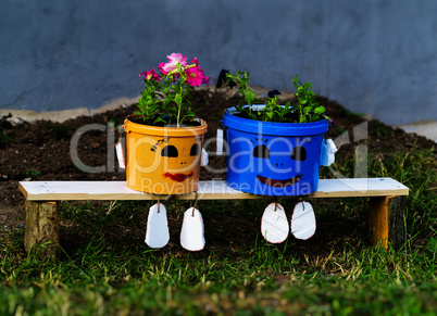 Horizontal flower pot on bench composition