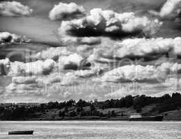 Horizontal vivid vibrant black and white Russia river clouds lan