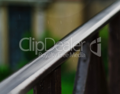 Horizontal balcony handrails under rain super detailed closeup a