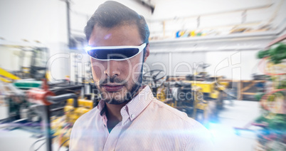 Composite image of close up of man using a virtual reality devic