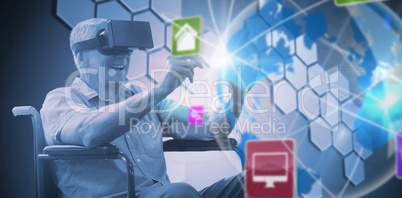 Composite image of senior man holding virtual glasses sitting on