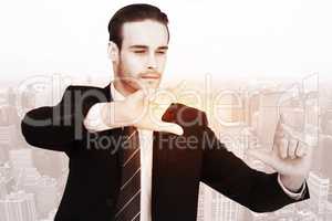 Composite image of happy businessman pointing with fingers