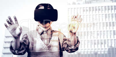 Composite image of young boy in red jumper with virtual reality