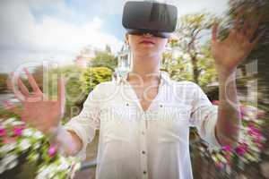 Composite image of woman using a virtual reality device