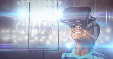 Composite image of little boy holding virtual glasses and lookin