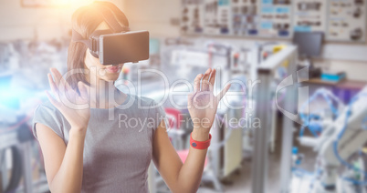 Composite image of businesswoman holding virtual glasses on a wh