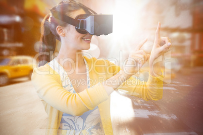 Composite image of woman using a virtual reality device