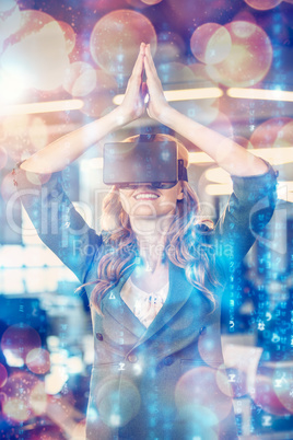 Businesswoman with hands joined using virtual reality simulator