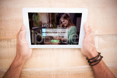 Composite image of login screen with smiling woman with pad and