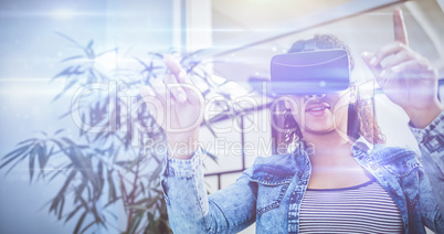 Low angle view of businesswoman enjoying augmented reality heads