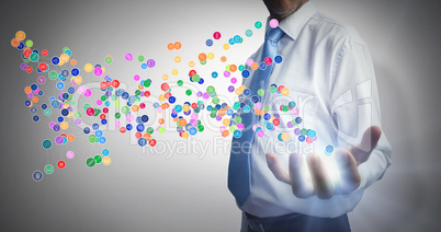 Composite image of businessman holding hand out