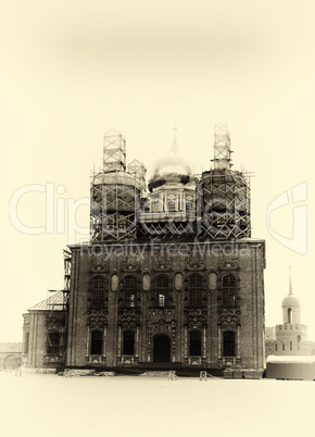 Vertical sepia vignette Russian orthodox church under constructi