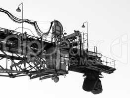 Horizontal black and white industrial machinery crane closeup ba