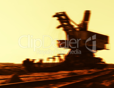 Horizontal vibrant sepia cyberpunk mining machine blurred backgr