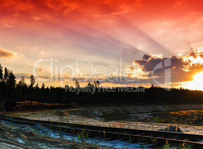 Horizontal red vivid sunset on vintage railroad track landscape