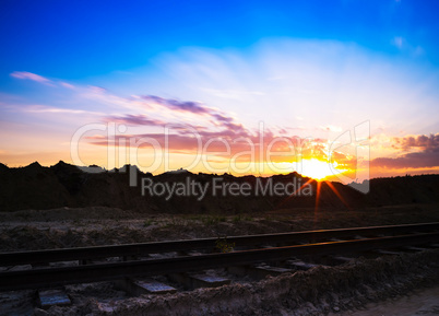 Horizontal vivid sunset on vintage railroad railway landscape ba