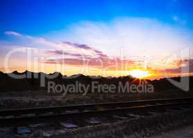 Horizontal vivid sunset on vintage railroad railway landscape ba