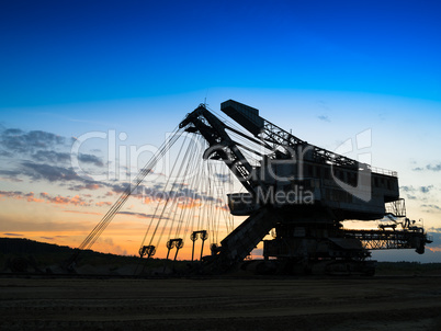 Horizontal vivid sunset industrial mining machine background bac