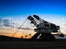 Horizontal vivid sunset industrial mining machine background bac