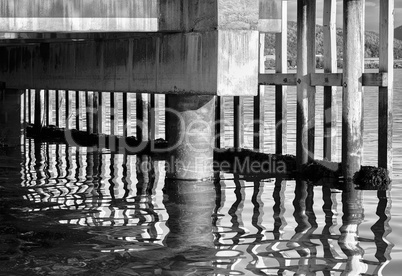 Black and white vibrant Norway quay reflection abstract backgrou