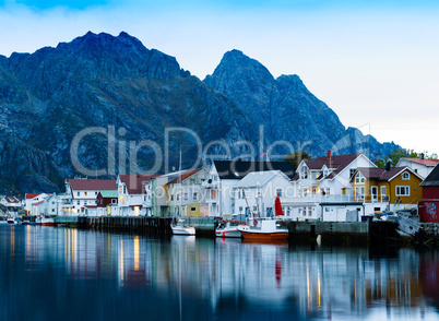 Horizontal vivid Norway town mountain pier reflections lights ba