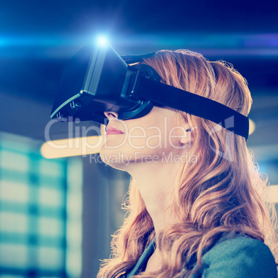 Young businesswoman using virtual reality simulator