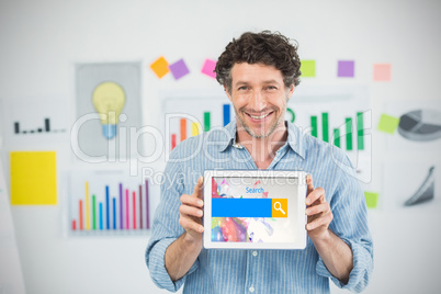 Composite image of businessman showing digital tablet with blank