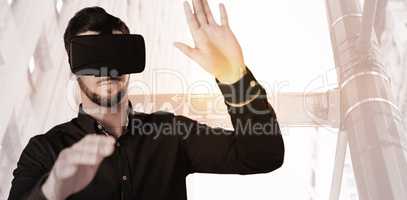 Composite image of businessman holding virtual glasses on a whit