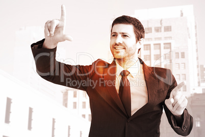 Composite image of happy businessman pointing with fingers