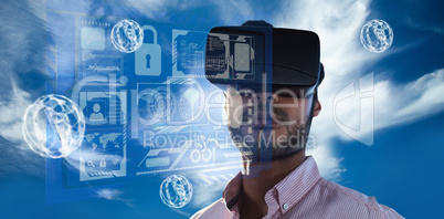 Composite image of portrait of businessman holding virtual glass