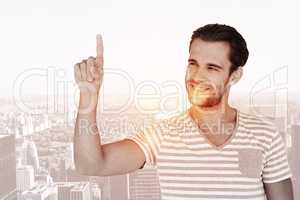 Composite image of handsome man pointing at something