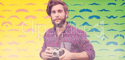 Composite image of portrait of confident hipster using camera