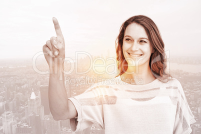 Composite image of pretty woman pointing with her finger