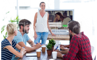 Composite image of casual businesswoman giving presentation to h