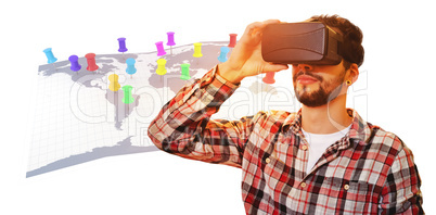 Composite image of casual man man holding virtual glasses on a w