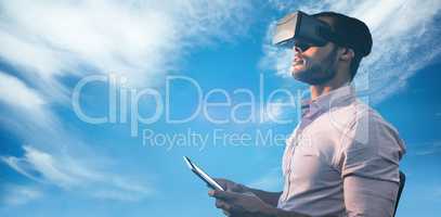 Composite image of side view of businessman holding virtual glas