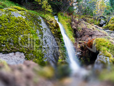 Horizontal vivid Norway waterfall flow bokeh abstraction nature