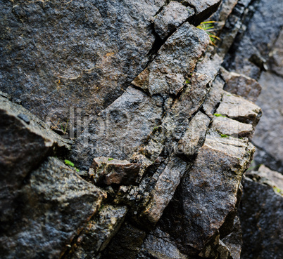 Square vivid rock texture with grass background backdrop