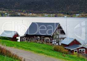Horizontal vivid Norway house on the bank of the river landscape