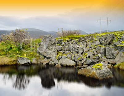 Horizontal vivid Norway orange sunset near road river reflection