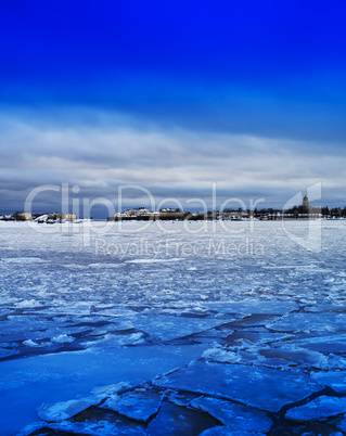 Vertical vivid ice on Finland lake landscape background backdrop