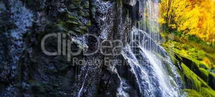 Horizontal vibrant waterfall bokeh background backdrop
